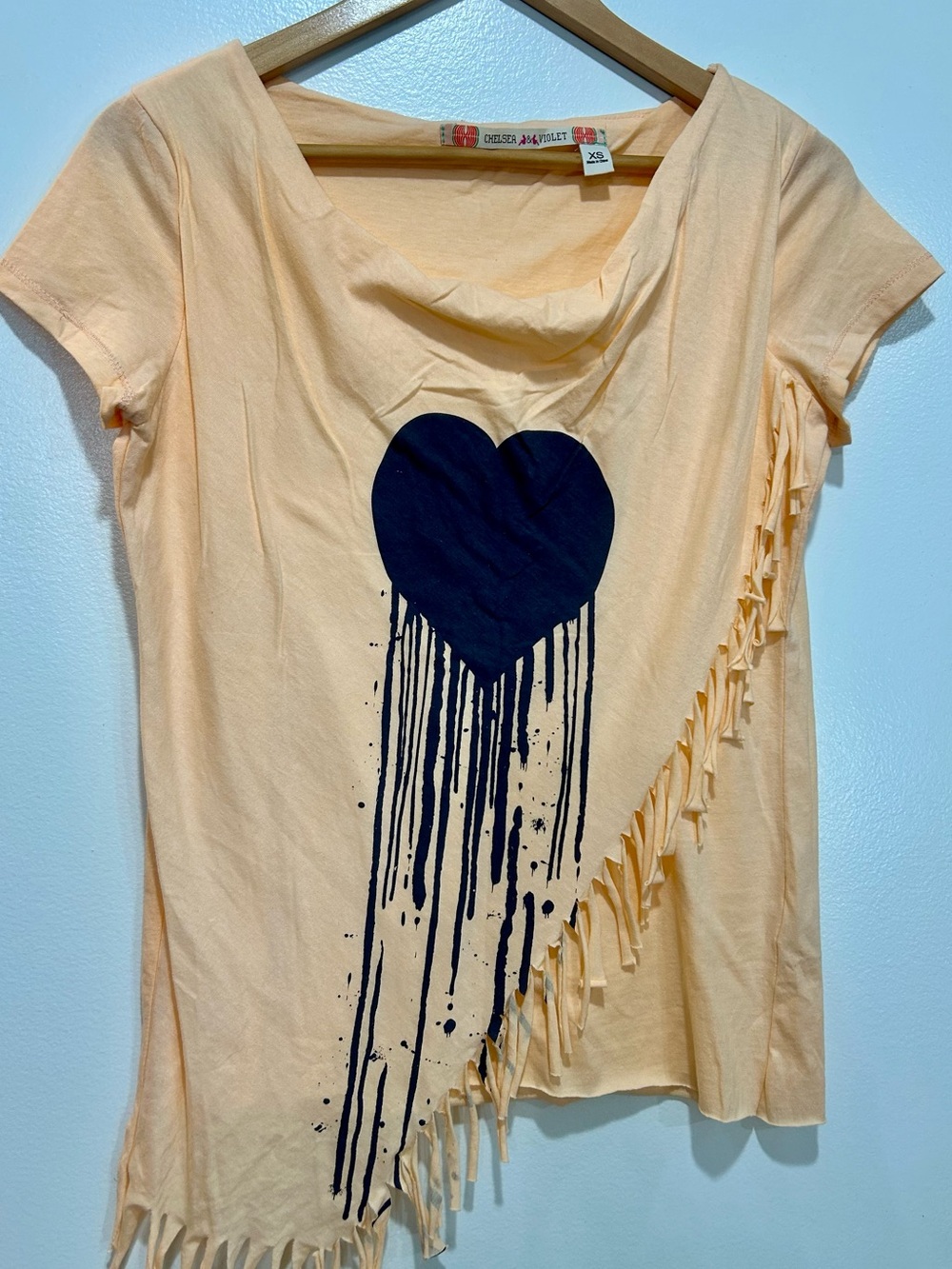 Chelsea & Violet Peach Short Sleeve Tee with Black Drip Heart and Fringe
